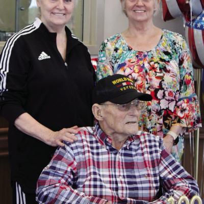 Randi Palmeri, left, and Nancy Wilson, daughters of World War II veteran and centenarian farmer Ernest Babek, at his 100th birthday celebration CDN | Elisha Rangel Veteran feted for 100th birthday