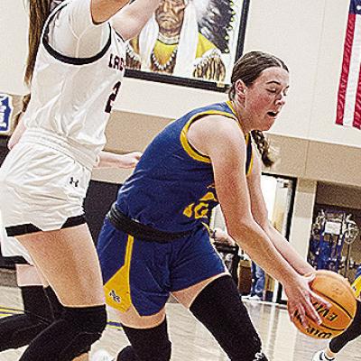 Arapaho-Butler’s Kelsey Garibay drives by a Cheyenne-Reydon defender during the girls’ championship game Saturday of the Western Equipment Classic. CDN | Sam Goodwyn