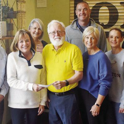 Clinton Classic Run Director Sue Cornell presented City Manager Robert Johnston with a check for the installation of a new park feature in McLain Rogers Park. Pictured front, from left, are Mayor David Berrong, Cornell, Johnston, Traci Heerwald, Stephanie Clinton Classic helps fund playground