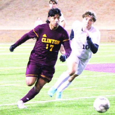 Clinton’s No. 17, Samuel Velez, races against an Elk City defender to the soccer ball during a game this past spring. CDN | Sam Goodwyn Velez wants to give back to sport of soccer