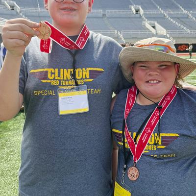 Kenneth Williams, left, and SJ Adkinson show off their bronze medals after competing in the Unified Bocce Ball at the Special Olympics Summer State Games last week at Oklahoma State University. CDN |Courtesy Photo