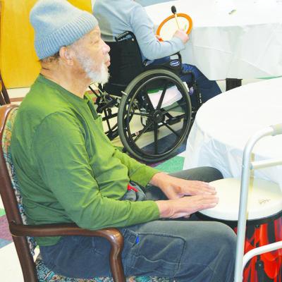 Harvey Jones is drumming along to the music at the Clinton Veterans Center. CDN | Christian Jacobsen