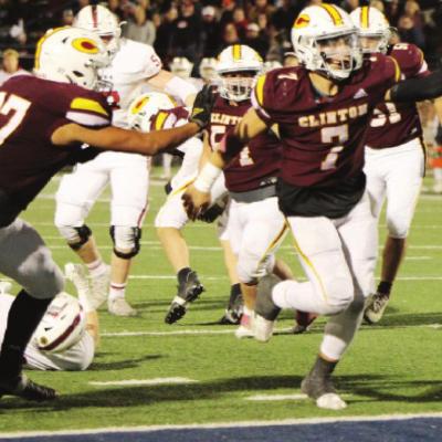 Caden Powell (7) makes the touchdown while Parrish Blackwolf (37) prepares to assit to obtain the points during the second half of the State game. Reds Win 17th State Championship Title