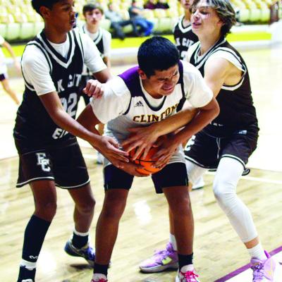Clinton’s Cruz Rios secures the basketball from the opposing Elk City players. CDN | Staff photo Clinton’s Cruz Rios
