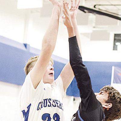 Corn Bible Academy’s Nathan Cooke shoots the ball over the Olustee-Eldorado defender during the Crusaders’ home win over the Diamondbacks. CDN | Sam Goodwyn