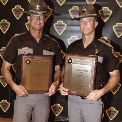 Lt. Steven Cornell, left, and Lt. Aaron Hunter, of Oklahoma Highway Patrol’s Troop H, hold their plaques designating their Trooper of the Year Award for Valor at Tuesday’s awards ceremony at the National Guard Armory in Norman. CDN | Courtesy photo