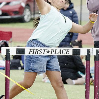 Dakota Chavez hurls the softball as hard as she can during Little Olympics at Clinton High School. CDN |Sam Goodwyn