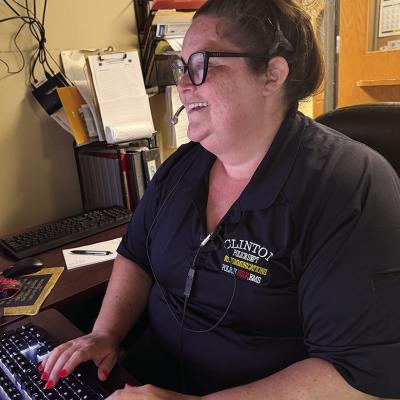 Dispatcher Gloria Kruer reviews officer locations during her shift. CDN | Shiann Dawson