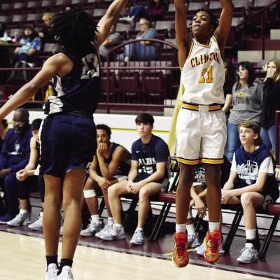 Senior Travonne Williams fires a three during the Altus contest. CDN | Emily Stephens Senior stresses team unity for Red Tornadoes