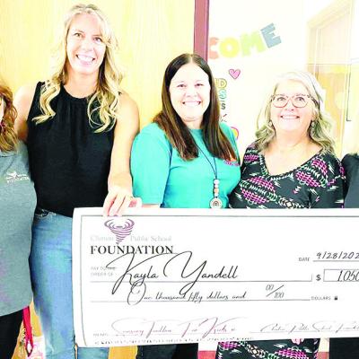 Clinton Public School Foundation members, from left, Tonya Gaunt, Mary Whitney and Debbie Carlisle, far right, present a check of $1,050 to Kayla Yandell, middle, and Principal Janalyn Taylor for Yandell’s proposed sensory toolbox for students at Nance CPSF awards 13 different projects