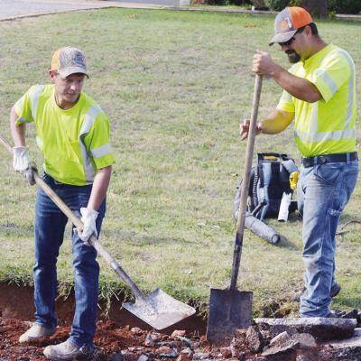 Derek Murray, left, and Alex Fraser work to remove old concrete and asphalt Tuesday on Old Route 66 on the west edge of town. CDN | Christian Jacobsen Derek Murray, left, and Alex Fraser work to remove old concrete and asphalt Tuesday on Old Route 66 on the west edge of town. CDN | Christian Jacobsen