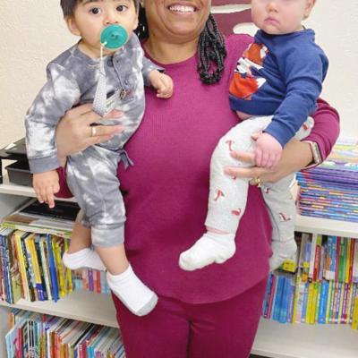 Tiny Tornadoes Daycare Director Urana Jefferson holds Adrian Nava, left, and Rhett Dixon. Jefferson has made career of loving lots of children