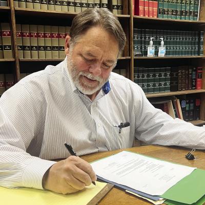 Richard Phillips looks over paperwork for an upcoming trial. CDN | Emily Stephens