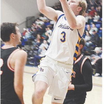 No. 3 Jiles Southall leaps in the air as he attempts a layup over a defender during A-B’s third-place game against Cheyenne-Reydon in the Western Equipment Classic. CDN | Sam Goodwyn