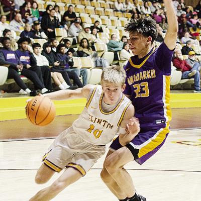 Clinton’s Ryder Adams, left, drives against the Anadarko defender during the Reds’ home game against the Warriors Tuesday in the Tornado Dome. CDN | Sam Goodwyn Clinton’s Ryder Adams, left, drives against the Anadarko defender during the Reds’ home game against the Warriors Tuesday in the Tornado Dome. CDN | Sam Goodwyn