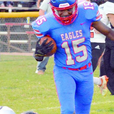 Terry Connizza breaks a tackle and scores a touchdown. CDN | Josh Jennings Burns Flat defeats Merritt, remains unbeaten