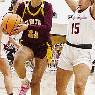 Clinton’s Ella Redshin, left, fights her way to the basket during the Lady Reds’ road game against Weatherford. CDN | Sam Goodwyn