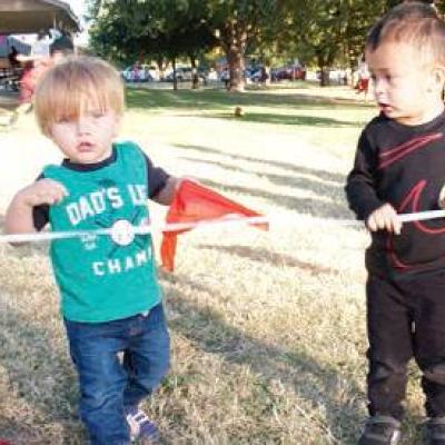 In the center photo are John Nash Cornell, left, 14-month-old son of John Lee and Kelly Cornell, and Giancarlo Coutino, 2, son of Lupe Marquez and Paulo Coutino. Huge crowd welcomes park upgrades