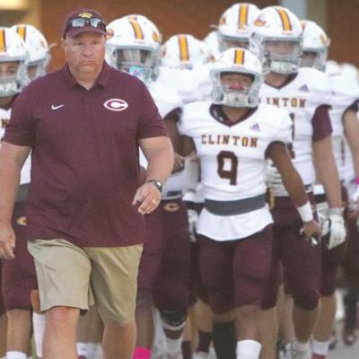 John Higbee leads the Red Tornadoes to the field before their 42-0 district win over Weatherford last week. The Reds lead District 4A-1 with a perfect 5-0 mark in district play. Clinton is 7-1 overall and ranked third in the Associated Press’ Coaches Po District crown up for grabs