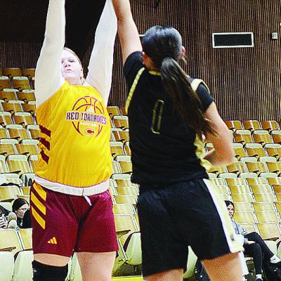 Lyssa Day shoots over a Lady Boomer defender during the JV home game last week against Woodward. CDN | Sam Goodwyn