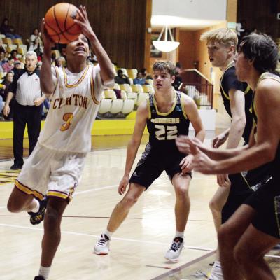No. 3 Titan Malone drives the ball past the Woodward defenders during the Reds’ recent thrilling come-from-behind overtime win over the Boomers. CDN | Sam Goodwyn Being a driving force on offense