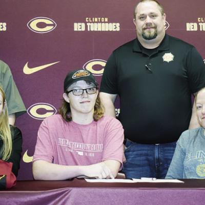 Joseph Hammans signs his letter of intent to join the Redlands Shooting Sports Team. Seated from left are Redlands Coach Shelby Skaggs, Joseph Hammans, and his mother, Jennifer Hammans; standing, CHS Ag teacher Mitchell Hunter, his father, Ray Hammans and Hammans commits