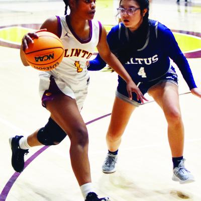 Clinton’s Tiauna Hester dribbles the ball past an Altus defender. Tonight the Clinton hoops teams face Blanchard for homecoming at the Tornado Dome. CDN | Emily Stephens Making her move