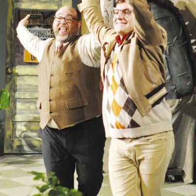 Mr. Mushnick (Christopher Curtis), left, and Seymour (Wesley Javorsky) dance with joy at the thought of adoption during “Little Shop of Horrors” at the Southwest Playhouse. CDN | Staff Photo