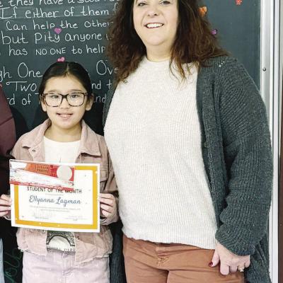 WOCS Head of School Dora Miller, right, honors Clinton student Ellyanna Lagman for being the student of the month for December. CDN | Courtesy photo