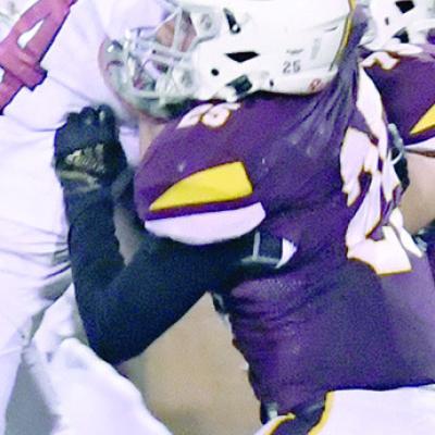 Garrison Rhoads blocks the Weatherford D-line during the Custer County Conflict. CDN | John Kinsey Pushing the line