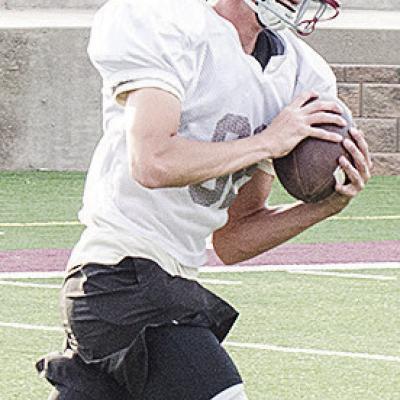 Clinton’s Judd Hall cuts upfield after catching the ball during spring practice in the Tornado Bowl. CDN | Sam Goodwyn