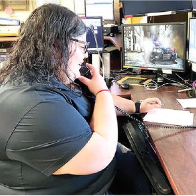 Dispatcher Victoria Luna answers community members’ questions during a shift at the Clinton Police Department. CDN | Nydia Campbell Luna’s focus has been about serving others