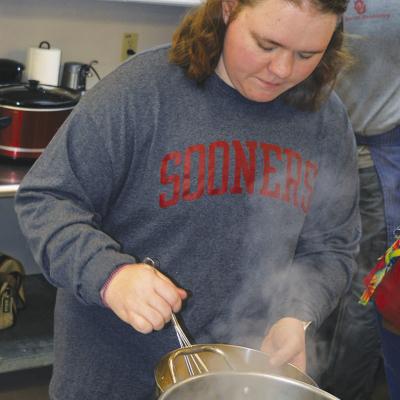 Emily Stephens works in the kitchen at Cornerstone Church during the annual Thanksgiving feast.