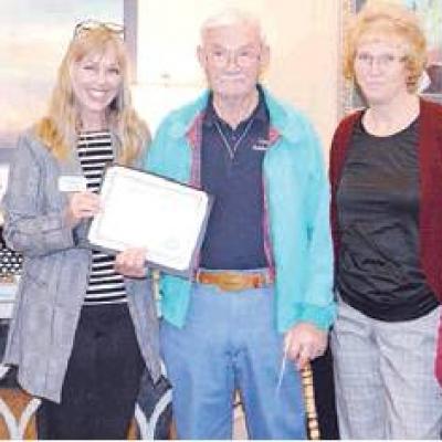 Presenting Bill Waldrop, center, with a certificate of appreciation at Angelwood Assisted Living are, from left, DeLynn Anderson, Cherrie Nutley, Waldrop, Beverly Sheldon and Barbara Davis. Waldrop retires after long volunteerism stint