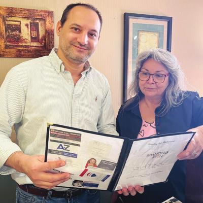 CDN | Emily Stephens Mohand Jubara, left, and Patti Robertson look over the menu at the Branding Iron to prepare for the day. Jubara proud to serve family, friends over years