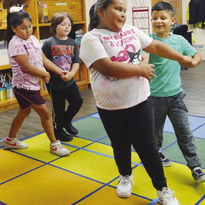 Students practicing square dancing in music class at Nance Elementary, from left are Adeleigh Rios, Asher LaRocco, Harlee French, and Mateo Galvan. CDN | Christian Jacobsen