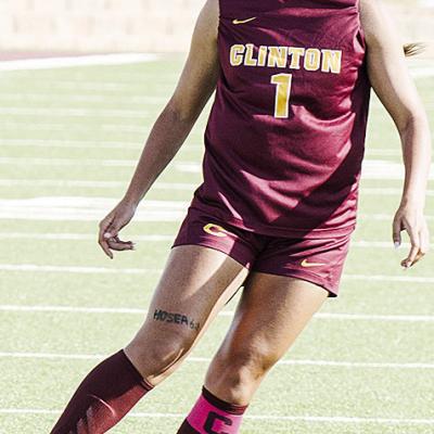 Clinton’s Alyvia Williams scans for an open teammate during the Lady Reds’ home win over Harding Charter. CDN | Sam Goodwyn