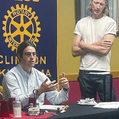 Architect Andrew Stone, left, and Jason Smith speak to the members of the Clinton Rotary Club about plans for revitalizing part of downtown Clinton at a recent meeting. CDN | Shiann Dawson