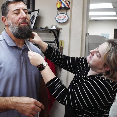 Adam Cisneros has his beard measured by Shanna Taylor to see how much it grows while participating in “No Shave November.” CDN | Emily Stephens Get ready for‘No Shave November’