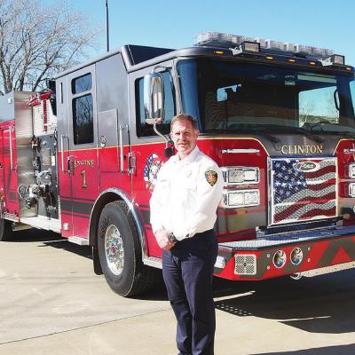 Chief Brett Russell is proud of his department’s new fire engine that should help the city of Clinton retain its outstanding ISO property insurance rating. CDN | Robert S. Bryan New $600,000 fire truck arrives