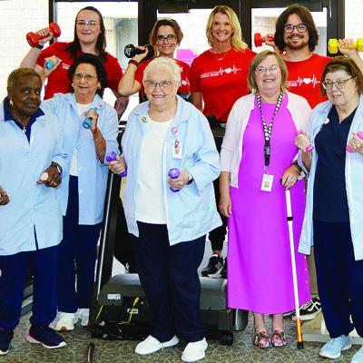 Celebrating the recent donation of a treadmill and dumbbells to the Cardiac Rehab department are front, from left, volunteers, Gloria Brown, Norma Fisher, Lois Schimmels, Debra Mendez, and Glenda Kindsfather; back, staff, Khristen Sawatzky, Janie Arnett, 