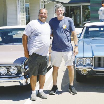 Daniel Patnode, left, with his 1960 Edsel Ranger and Dan Friedberg with his 1970 Oldsmobile Cutlass Supreme SX visit the Route 66 Museum Wednesday while on the “Main Street of America” Centennial Caravan. CDN | Christian Jacobsen