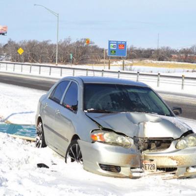 Car strikes exit sign