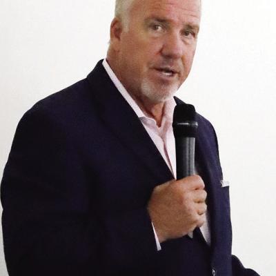 Insurance boss pays visit here