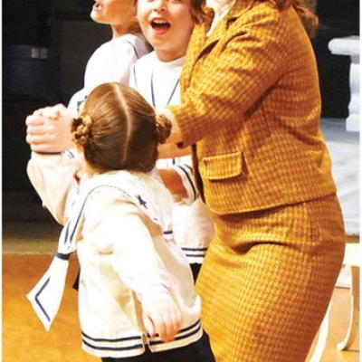 Maria (Laurin Townsend) sings with Von Trapp children, from front, Gretl (Ainsley House), Marta (Mayzie Sadler) and Brigitta (Evie Tucker) after returning from the abbey during the Southwest Playhouse’s production of “The Sound of Music.” CDN | Cale My favorite things