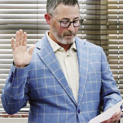 John Coleman takes the oath of office as the newest member of the Clinton Public Schools Board of Education during Monday’s meeting. CDN | Elisha Rangel School board appoints new member