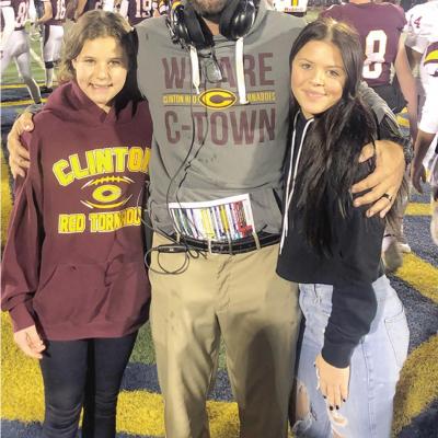 Reggie Weil, pictured middle, after the 2022 football state championship win against Tuttle, with his two daughters, Caylyn, left and Gentry, right. CDN | Courtesy photo Seven state championships in 20 years