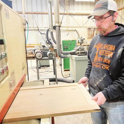 Jeff Hunter works to prepare a wood fixture for a customer. CDN | Emily Stephens Hunter, Woodall make 66 Wood pieces fit