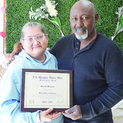 Shondra and Andre Williams of Nature’s Farm Girl show off their Marquis Who’s Who award. CDN | Courtesy photo