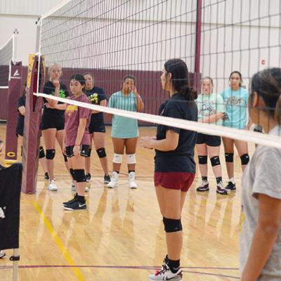 New Clinton volleyball coach Emma Seiter, left, coaches the volleyball team during practice Monday. CDN | Josh Jennings CHS volleyball plans to play aggressive